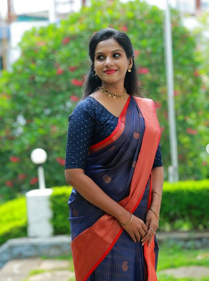 Shamatmika Devi Sreekumar in a navy silk saree